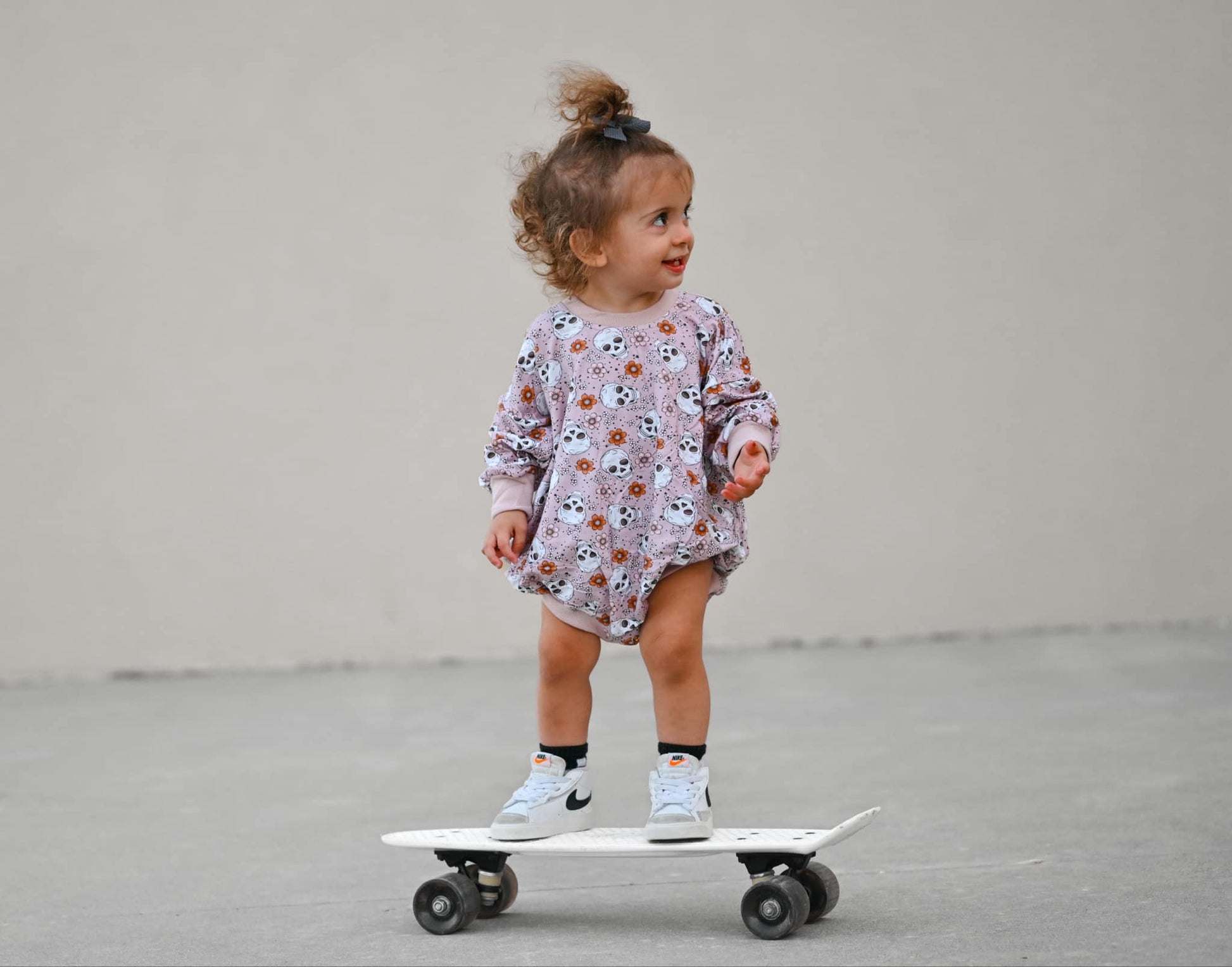 Purple Floral Skulls Bamboo Bubble Romper by Little Joy Co.